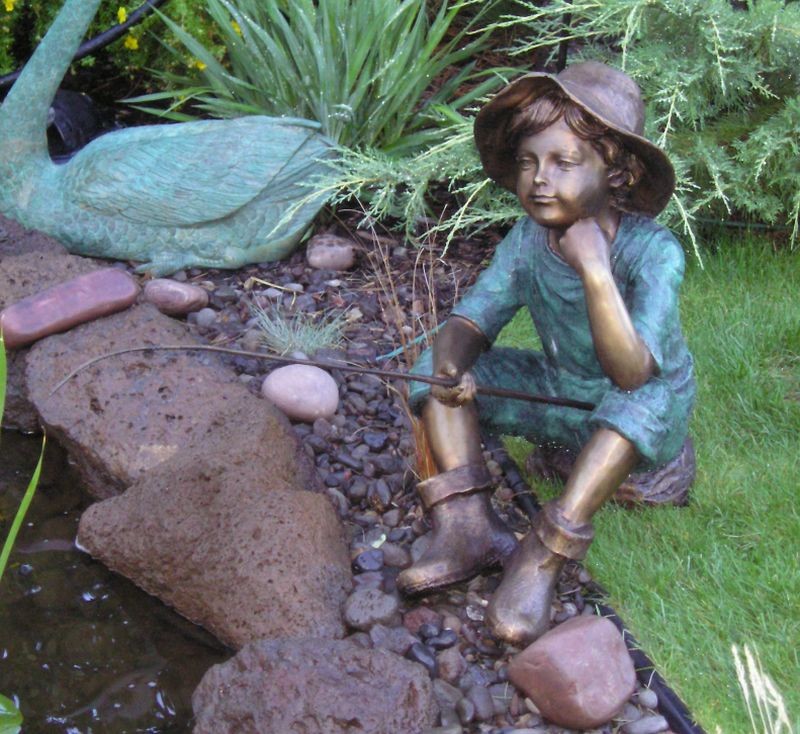 Boy on rock fishing