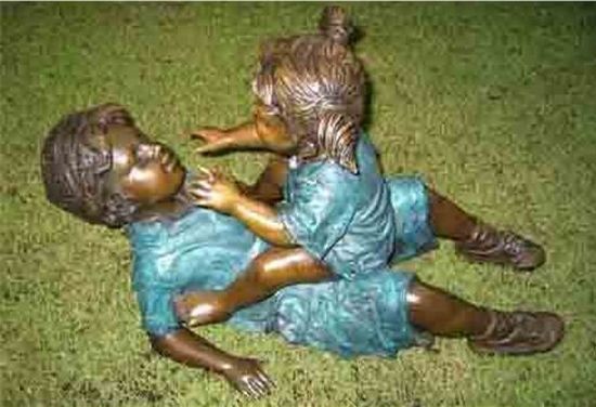 Boy with little sister playing