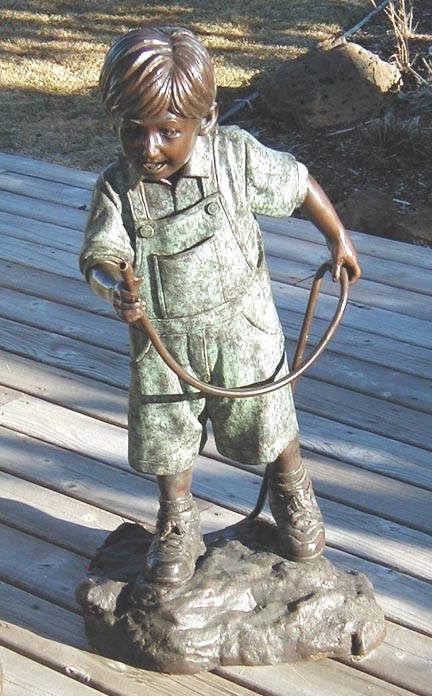 Large boy with hose
