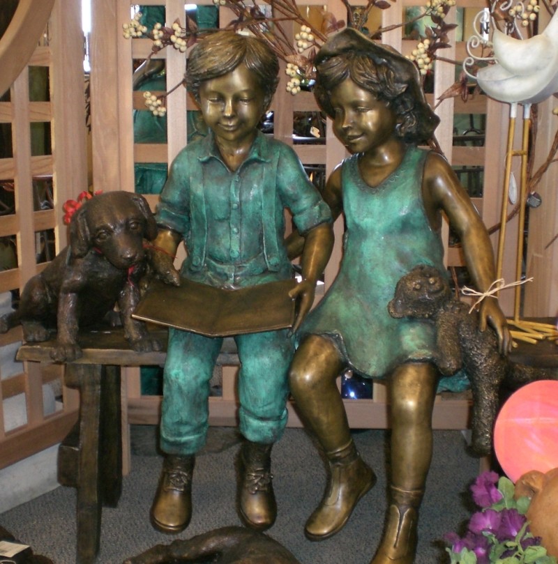 Read to me- boy & girl on bench