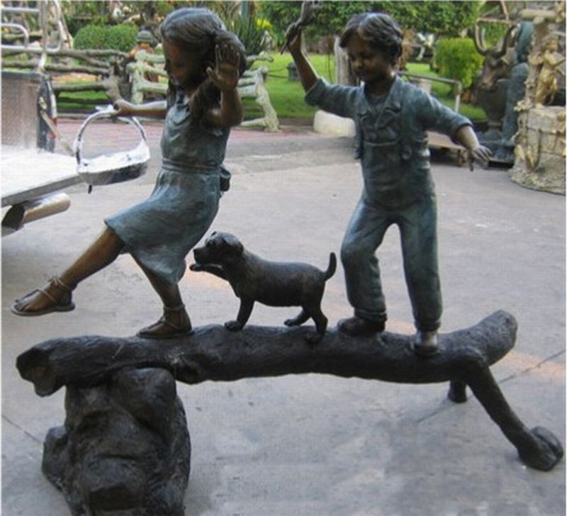 The adventure- boy,girl, &dog on log