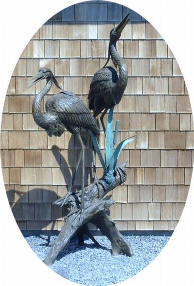 Two herons on a log