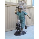 Playing fetch- boy, stick, & dog
