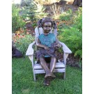 Girl with lab puppy in lap