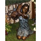 Girl kneeling with cat