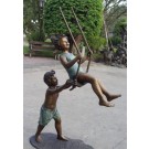 Boy & girl swinging