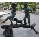 The adventure- boy,girl, &dog on log