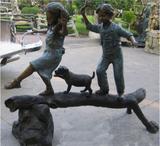 "The adventure" Boy and Girl on Log Statue